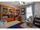 Cozy home office with desk, bookshelves, and a comfortable rocking chair at 19 Autumn Ne Pl, White, GA 30184
