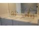 Elegant bathroom with double vanity, marble countertops, and luxurious gold-toned fixtures at 2085 Dellwood, Decatur, GA 30032