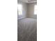 Bright bedroom with plush carpeting, neutral walls, and abundant natural light from two windows at 2085 Dellwood, Decatur, GA 30032