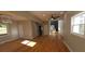 Bright and spacious living room featuring hardwood floors, modern lighting and a glimpse of the staircase at 2085 Dellwood, Decatur, GA 30032