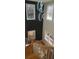 Stylish staircase featuring hardwood steps, white risers, and natural lighting at 2085 Dellwood, Decatur, GA 30032