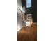 Stylish staircase featuring hardwood steps, white risers, and natural lighting at 2085 Dellwood, Decatur, GA 30032