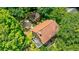 Aerial view of the house showcasing a red-tiled roof and mature tree coverage at 27 S Avondale Rd, Avondale Estates, GA 30002