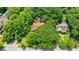An aerial view showcases the house and its wooded surrounding, offering a private retreat at 27 S Avondale Rd, Avondale Estates, GA 30002