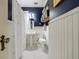 Charming bathroom featuring a pedestal sink, navy walls and white beadboard paneling at 27 S Avondale Rd, Avondale Estates, GA 30002