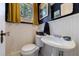 Stylish powder room with blue walls, white wainscoting, and a pedestal sink with decorative hardware at 27 S Avondale Rd, Avondale Estates, GA 30002