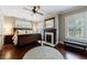 Comfortable bedroom featuring a ceiling fan, fireplace, and window shutters at 27 S Avondale Rd, Avondale Estates, GA 30002