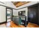 Upstairs hallway with hardwood floors, leading to a bedroom and bathroom at 27 S Avondale Rd, Avondale Estates, GA 30002