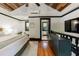 Bedroom featuring a wood ceiling, TV, wooden floors and an ensuite bathroom at 27 S Avondale Rd, Avondale Estates, GA 30002