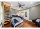 Serene bedroom with hardwood floors, a ceiling fan, ladder access to loft, and comfortable seating at 27 S Avondale Rd, Avondale Estates, GA 30002