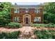 Charming brick home featuring manicured landscaping, a welcoming entrance, and classic architectural details at 27 S Avondale Rd, Avondale Estates, GA 30002