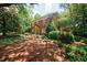 A view of this brick home highlighting its architectural style and mature landscaping at 27 S Avondale Rd, Avondale Estates, GA 30002