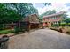 Beautiful home with mature trees, a covered porch and long driveway at 27 S Avondale Rd, Avondale Estates, GA 30002