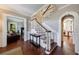 Inviting foyer boasts hardwood floors, white trim, a staircase, and access to other living areas at 27 S Avondale Rd, Avondale Estates, GA 30002