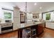 Bright kitchen featuring stainless steel appliances, white cabinets, an island, and beautiful wood floors at 27 S Avondale Rd, Avondale Estates, GA 30002