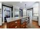 Spacious kitchen featuring granite counters, stainless appliances, a central island, and custom cabinetry at 27 S Avondale Rd, Avondale Estates, GA 30002