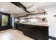 Basement kitchenette has black cabinets, wood countertops, and stainless-steel appliances at 27 S Avondale Rd, Avondale Estates, GA 30002