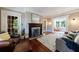 Spacious living room featuring hardwood floors, a fireplace, and comfortable seating at 27 S Avondale Rd, Avondale Estates, GA 30002