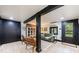 Finished basement featuring exposed beams, backyard access, and comfortable seating at 27 S Avondale Rd, Avondale Estates, GA 30002