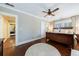 Spacious main bedroom with wood floors, neutral walls, and an open doorway, leading into an en-suite bath at 27 S Avondale Rd, Avondale Estates, GA 30002