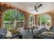 Beautiful sunroom with brick walls, large windows with views of greenery and natural light at 27 S Avondale Rd, Avondale Estates, GA 30002