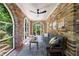 Bright sunroom featuring brick walls, arched windows, and comfortable seating at 27 S Avondale Rd, Avondale Estates, GA 30002