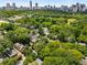 Wide aerial view showing the property in relation to the city skyline and nearby park at 626 Elmwood Ne Dr, Atlanta, GA 30306