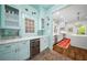 Butler's pantry has custom cabinets, wine refrigerator, and brick floors at 626 Elmwood Ne Dr, Atlanta, GA 30306