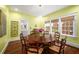 Elegant dining room with hardwood floors, ample windows, and decorative lighting at 626 Elmwood Ne Dr, Atlanta, GA 30306