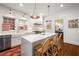 Bright kitchen featuring white cabinets, stainless steel appliances, and a center island with seating at 626 Elmwood Ne Dr, Atlanta, GA 30306
