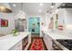 Gourmet kitchen featuring stainless steel appliances, white cabinets, and a center island with seating at 626 Elmwood Ne Dr, Atlanta, GA 30306