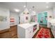 Modern kitchen features stainless steel appliances, large island, and hardwood floors at 626 Elmwood Ne Dr, Atlanta, GA 30306