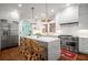 Modern kitchen boasts stainless appliances, a spacious island, and seating at 626 Elmwood Ne Dr, Atlanta, GA 30306