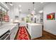 Well-lit kitchen with stainless steel appliances, white cabinets, and a spacious island at 626 Elmwood Ne Dr, Atlanta, GA 30306