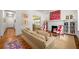 Bright living room featuring hardwood floors, fireplace, and comfortable seating at 626 Elmwood Ne Dr, Atlanta, GA 30306