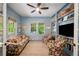 Inviting living room featuring custom built-in shelves and an abundance of natural light at 626 Elmwood Ne Dr, Atlanta, GA 30306