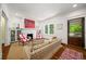 Bright living room features a fireplace, built-in shelving, and comfortable seating at 626 Elmwood Ne Dr, Atlanta, GA 30306