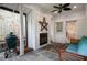 Outdoor patio featuring a fireplace, fan, and cozy seating with a grill at 626 Elmwood Ne Dr, Atlanta, GA 30306