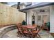 Patio with stone flooring, grill, outdoor table and chairs with manicured landscaping at 626 Elmwood Ne Dr, Atlanta, GA 30306