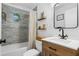 Updated bathroom features modern vanity and tiled shower with tub at 1556 Braeburn Se Dr, Atlanta, GA 30316