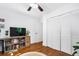 Bright bedroom features hardwood floors, ceiling fan and large closet at 1556 Braeburn Se Dr, Atlanta, GA 30316