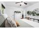 Serene bedroom featuring hardwood floors, neutral decor, dresser, and ample natural light at 1556 Braeburn Se Dr, Atlanta, GA 30316