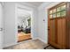 Inviting entryway featuring a wooden door and views to the living room at 1556 Braeburn Se Dr, Atlanta, GA 30316