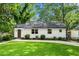 Charming home with a well-manicured lawn and a welcoming exterior at 1556 Braeburn Se Dr, Atlanta, GA 30316