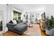 Bright living room with modern furnishings, hardwood floors, and recessed lighting at 1556 Braeburn Se Dr, Atlanta, GA 30316