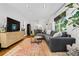 Spacious living room with a cozy sectional sofa and hardwood floors at 1556 Braeburn Se Dr, Atlanta, GA 30316