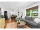Comfortable living area with a sectional sofa, area rug, and natural light at 1556 Braeburn Se Dr, Atlanta, GA 30316