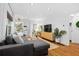 Charming living room with hardwood floors that connect to the dining area at 1556 Braeburn Se Dr, Atlanta, GA 30316