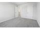 Carpeted bedroom featuring two doors at 1911 Fairchild Ave, Grayson, GA 30017