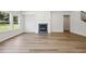 Bright living room showcasing hardwood floors, fireplace, and large windows at 1911 Fairchild Ave, Grayson, GA 30017